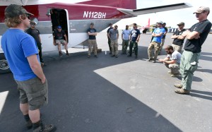 Smokejumpers from BLM Boise, Idaho, are briefed on the flight operations of a CASA-212 on Saturday afternoon, May 23, 2015, at the BLM Alaska Smokejumpers Base on Ladd Air Field at Fort Wainwright. Because of high fire danger in Alaska, 16 additional smokejumpers were brought to the state. Once the crews from Boise have completed their orientation to Alaska they will enter into the fire assignment rotation. Red Flag Warnings are forecasted to remain in effect for the Interior of Alaska through the Memorial Holiday weekend. Sam Harrel BLM-AFS photo
