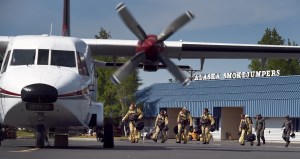 Smokejumpers from BLM Boise, Idaho, board a CASA-212 to make their practice jump Saturday afternoon, May 23, 2015, at the BLM Alaska Smokejumpers Base on Ladd Air Field at Fort Wainwright. Because of high fire danger in Alaska, 16 additional smokejumpers were brought to the state. Once the crews from Boise have completed their orientation to Alaska they will enter into the fire assignment rotation. Red Flag Warnings are forecasted to remain in effect for the Interior of Alaska through the Memorial Holiday weekend. Sam Harrel BLM-AFS photo