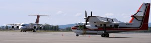 A BAe 146 tanker, left, taxies on Ladd Field past a CL-415 Superscooper on Tuesday, May 19, 2015, at BLM Alaska Fire Service at Fort Wainwright. The two aircraft are new to fire suppression efforts in Alaska. Sam Harrel BLM-AFS photo