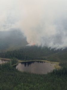 Smoke rises from the 9,000-acre Chisana River 2 Fire burning in the Wrangell-St. Elias National Park and Preserve and the Tetlin National Wildlife Refuge in this photo taken Thursday, June 11, 2015. The fire is approximately 20 miles south of the Alaska Highway and about 25 miles west of the Canadian border. Alaska Division of Forestry photo.
