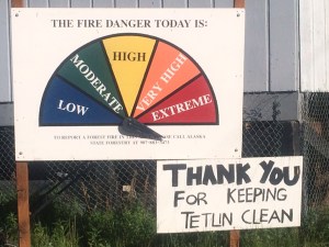 An Alaska Division of Forestry fire danger sign in the community of Tetlin south of Tok sums up the current fire danger in Alaska.