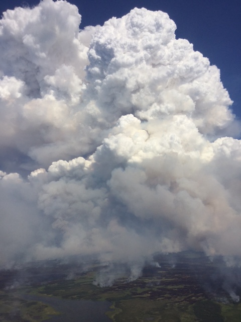 The Mauneluk River 2 fire near the Gates of the Arctic National Park and Preserve puts up smoke while burning through almost 34,000 acres and three miles on July 15, 2016. Photo by Ryan McPherson, BLM Alaska Fire Service.