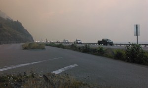 Traffic on the Seward Highway has been reduced to one lane with a pilot car due to heavy smoke and fire activity near the road. Lori Wiertsema/Alaska Division of Forestry