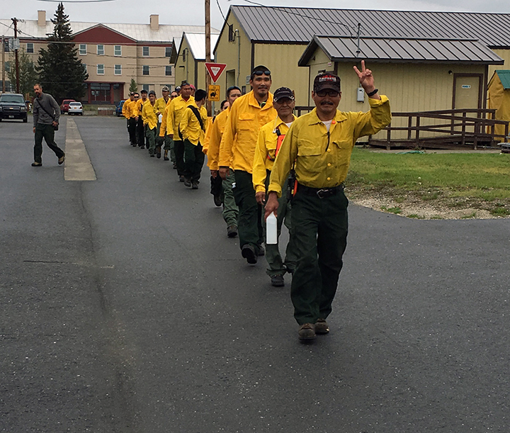 Emergency firefighter crews from Chevak, Hooper Bay, Huslia and Kaltag line up to board a jet that will take them to the Lower 48 to work on wildland fires. Photo by Darla Theisen/Alaska Division of Forestry