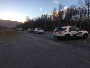An Alaska State Trooper vehicle blocks the Glenn Highway early Monday morning during a temporary closure. The road was closed for a short time while a bulldozer constructed a fire line connected to the highway to prevent the Moose Creek Fire from encroaching on the road. Photo by Sierra Stark