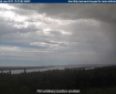 A picture taken from the FAA webcam in Anvik at 1:13 p.m. on June 6, 2017 shows showers south of the village. The Deadmans Slough Fire is burning southwest of Anvik.