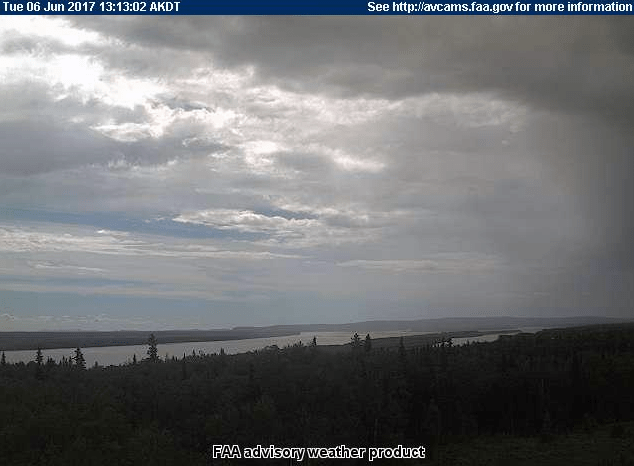 A picture taken from the FAA webcam in Anvik at 1:13 p.m. on June 6, 2017 shows showers south of the village. The Deadmans Slough Fire is burning southwest of Anvik.