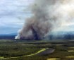The Khotol Fire burning 14 miles east of Kaltag roared back to life on Tuesday, putting up smoke and prompting fire officials to send 16 smokejumpers to provide protection for a nearby cabin and two Native allotments. Photo Courtesy Doug Downes//BLM Alaska Fire Service
