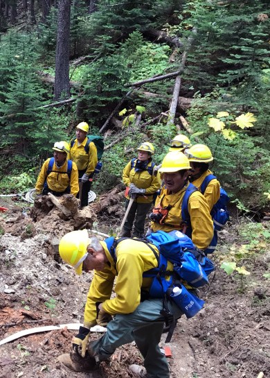 Members of the Type 2 Emergency Firefighter crew from Nulato work on securing line on the Caribou Fire in Montana near the Canadian border. The crew is among the final four of 23 EFF crews that worked on fires in the Lower 48. Photo by Travis McCabe//BLM Alaska Fire Service