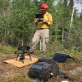 BLM Alaska Fire Service drone pilot Jason Brooks readies the quadcopter for take off before flying over the North Robertson Fire near Tok on June 10, 2017.