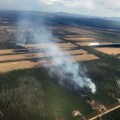 Smoke rises from a wildfire along Tanana Loop Extension in Delta in May 2018. Photo: Tim Whiteselll/DOF