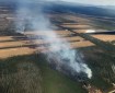 Smoke rises from a wildfire along Tanana Loop Extension in Delta in May 2018. Photo: Tim Whiteselll/DOF