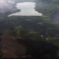The Zitziana River Fire (#133) was smoldering on the east side (to the left) of the Kindamina Lake Saturday. Conditions moderated Saturday to allow firefighting personnel to fly over the fire and get a good look at it. Photo by Abe Davis, BLM AFS