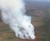 Lines of red fire retardant boxed the 60-acre Minchumina Fire (#213) burning near Lake Minchumina Friday evening. Photo by Tim Whitesell, Alaska Division of Forestry