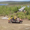 Photo of the Type 2 Emergency Firefighter Fairbanks #1 hand crew with some mock warfare infrastructure at the military observation sites north of the Oklahoma Range on the west side of Donnelly Training Area West.