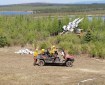 Photo of the Type 2 Emergency Firefighter Fairbanks #1 hand crew with some mock warfare infrastructure at the military observation sites north of the Oklahoma Range on the west side of Donnelly Training Area West.