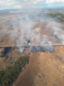 Photo of smoke from a slop over of the containment line.