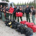BLM Alaska Fire Service Chena Interagency Hotshots unload their gear shortly arriving at a staging area for the Oregon Lakes Fire Sunday night. The Midnight Sun and Chena Hotshots are joining the suppression efforts on the fire today. Photo by Beth Ipsen, BLM AFS