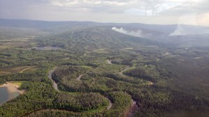 Smoke from the Olnes Pond Fire (#346) as seen from a helicopter carrying firefighers to the fire. Olnes Pond is in the bottom left of the photo. Photo by Ernest Prax/Alaska Division of Forestry