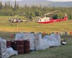 Two helicopters sit at the helibase for the Caribou Creek Fire iin Two Rivers on Wednesday, June 26, 2019. The helicopters are used to shuttle crews and supplies in and out of the fire. Photo by Tim Mowry/Alaska Division of Forestry