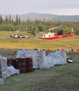Two helicopters sit at the helibase for the Caribou Creek Fire iin Two Rivers on Wednesday, June 26, 2019. The helicopters are used to shuttle crews and supplies in and out of the fire. Photo by Tim Mowry/Alaska Division of Forestry