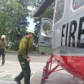 James Lilly, front, and other crew members of the 20-man White Mountain Type 2 Initial Attack Crew, boards a helicopter at Fairbanks Area Forestry on Wednesday, June 19, 2019 to be shuttled in to the Caribou Creek Fire. Photo by Tim Mowry/Alaska Division of Forestry