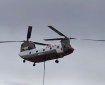 A Chinook helicopter delivers water to the Swan Lake Fire near Sterling, AL.
