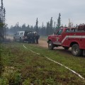 A brush truck from the Anderson Volunteer Fire Department is parked along Kobe Ag Road near the Kobe Fire on Friday morning, July 12, 2019 as members of the White Mountain Type 2 Initial Attack Crew gear up to head to the fire after arriving Friday morning. Photo by Chief Scott Thompson/Anderson Volunteer Fire Department