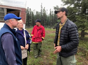 Kobe Fire Operations Section Chief James Ray talks to Denali Borough Mayor Clay Walker, left, and Fairbanks Daily News-Miner reporter Kris Capps on Friday, July 12, 2019. Photo by Chris Noel/Denali Borough 