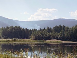 A small puff of smoke rises from the Nugget Creek Fire (#323) on Monday, July 22, 2019 along Chena Hot Springs Road. Photo by Liv Stecker/Alaska Division of Forestry