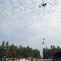 A helicopter transports a sling load of supplies to firefighters working on the Deshka Landing Fire on Tuesday, August 21, 2019. Photo by Alan Hoffmeister/Team 10 Information Officer