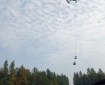 A helicopter transports a sling load of supplies to firefighters working on the Deshka Landing Fire on Tuesday, August 21, 2019. Photo by Alan Hoffmeister/Team 10 Information Officer