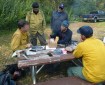 Initial Attack Incident Commander Tamar Young, seated in middle, briefs Cary Neu, incoming Division Supervisor with the NW Incident Management Team #10, seated on left, on Tuesday, August 20, 2019 as management of the fire transitions to the new team. Photo by Alan Hoffmeister/Team 10 Information Officer