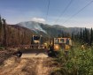 Personnel working on the Swan Lake Fire use a hydro seeder to reseed a section of dozer line on Monday, August 13, 2019. Photo by Alaska Division of Forestry