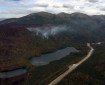 Smoke from the east side of the Swan Lake Fire rises above Upper Jean Lake along the Sterling Highway on Thursday, August 16, 2019. Photo by Brentwood Reid/Alaska Division of Forestry