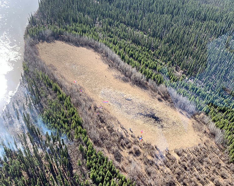 Photo of fire on landscape.