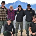 Six members of the Grande Ronde rappel crew pose for a group photo with Pioneer Peak in the background.