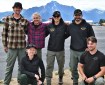 Six members of the Grande Ronde rappel crew pose for a group photo with Pioneer Peak in the background.