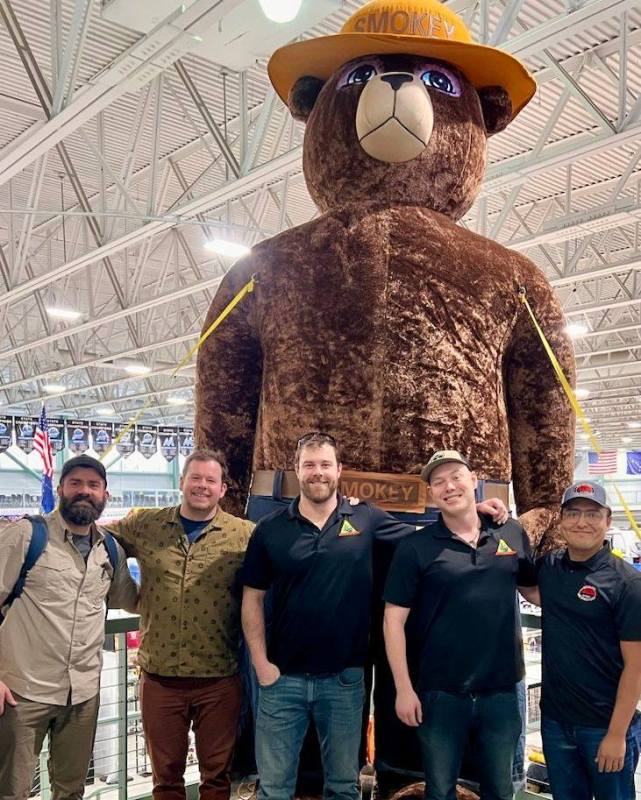 Mat-Su Prevention Officers with Smokey Bear at the Mat-Su Outdoorsman Show