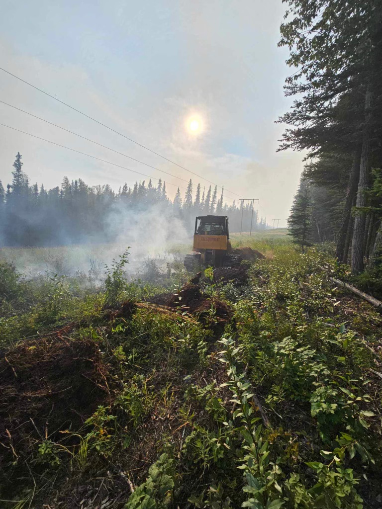 A dozer works on protecting the power line along Pogo Mine Road for the Pogo Mine Road Fire (#191). Photo/Levi Tucker, Tanana Chiefs Crew Dozer Boss
