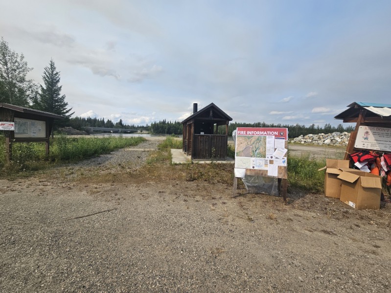 Fire Information board for the Teklanika River Fire located at the boat launch on Totcahket Road.