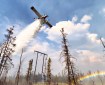 A Fire Boss drops water while protecting power lines on the Pogo Mine Road Fire (#191).