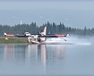 A Superscooper CL-415 aerial firefighting aircraft skims 1,600 gallons of water during suppression operations in the Interior. Photo: Kale Casey / DOF