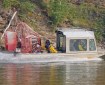 Boat carrying firefighters up Salcha River.
