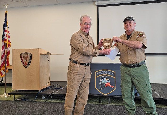 Instructor Al Cain receives thank you gift