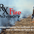 Graphic for prescribed burning with title of "Rx Fire Advisory" and featuring a photo of a firefighter using a drip torch to light dead grass on fire.