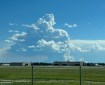A large column of smoke and clouds looming over the landscape in this photo taken from the BLM AFS facilities on Fort Wainwright.