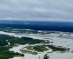 landscape scale view of the Tanana River with small smokes from the fire in the far distance