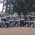 Photo of Alaskan firefighters in front of wildland firefighting engines in Oregon