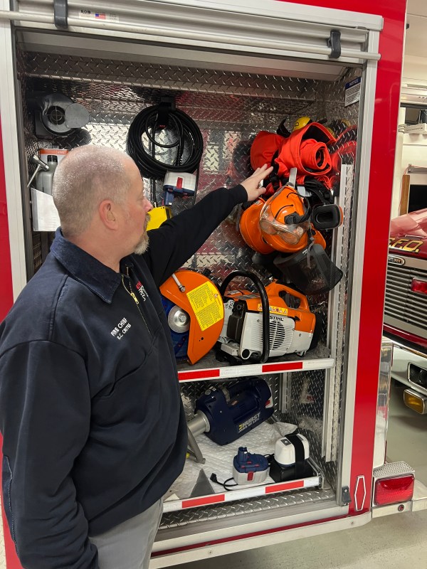 Chief Crites with the Seward Volunteer Fire Department displays recent personal protective gear the department was able to purchase with VFC funding. Photo/DOF